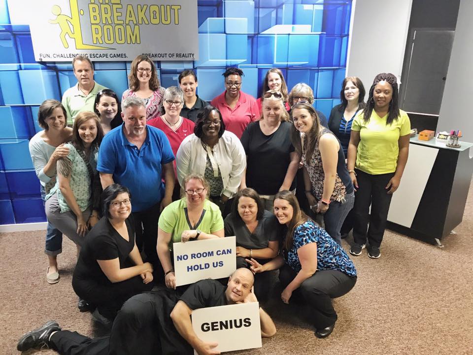 Employees enjoy corporate team building at the breakout room escape room in wilmington north carolina